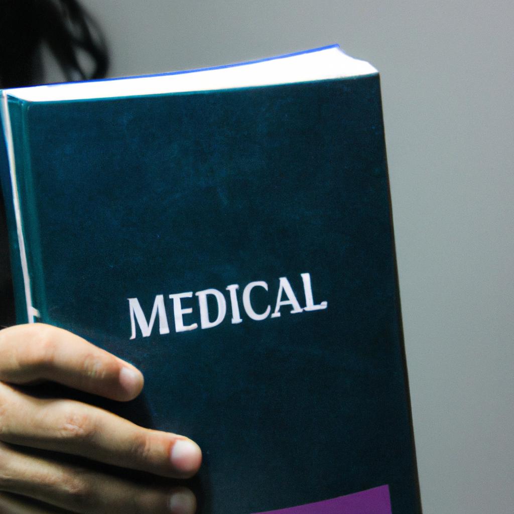 Person holding a medical book